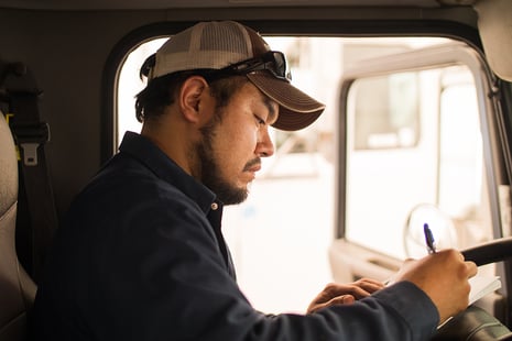 Driver making a checklist in a truck